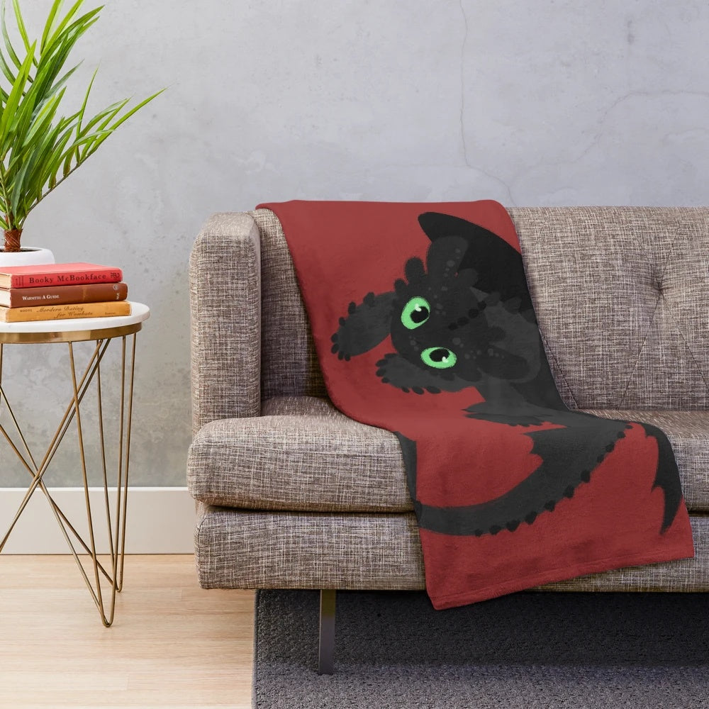 Toothless-inspired plush blanket featuring the iconic Night Fury dragon from How to Train Your Dragon