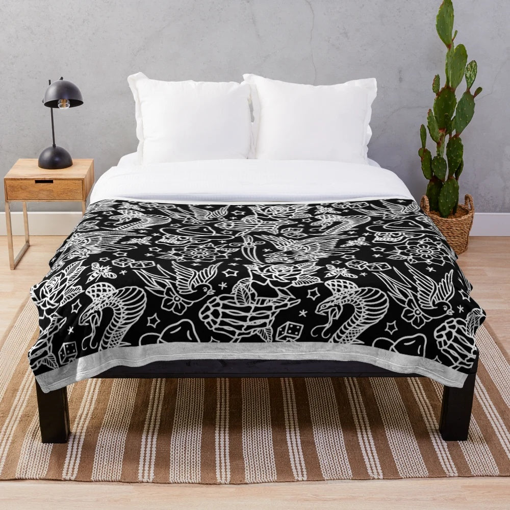 Traditional tattoo inspired plush blanket featuring eagle, skull, and other classic tattoo designs