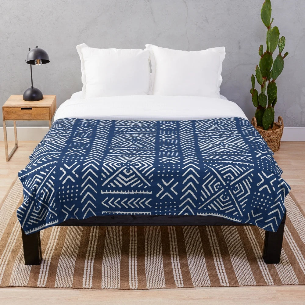 Tribal-inspired dark blue plush blanket featuring line mud cloth design