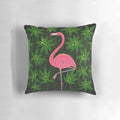 Vibrant pink flamingo print on a tropical leaf patterned decorative pillow