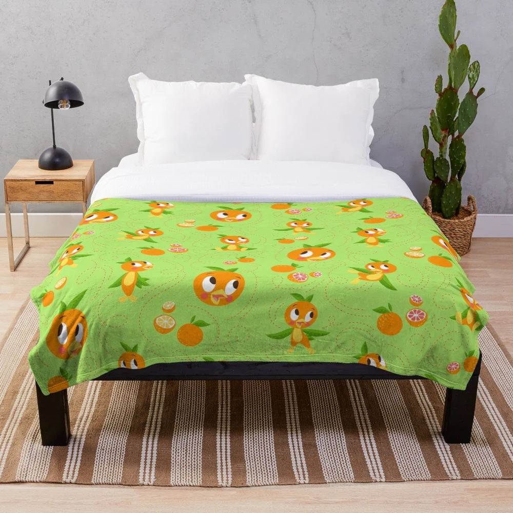 Orange bird plush blanket with a tropical floral background