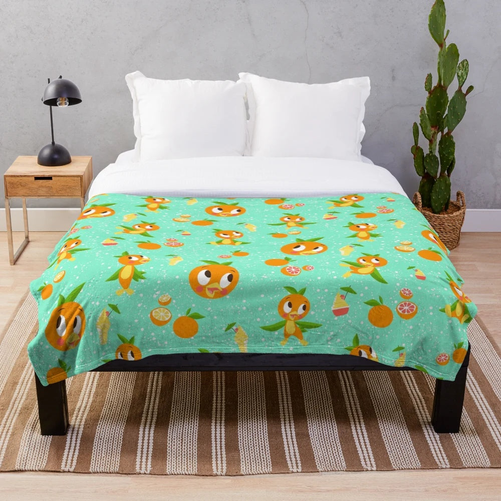 Soft plush blanket featuring an orange bird design inspired by the iconic Dole Whip treat from Walt Disney World's Adventureland