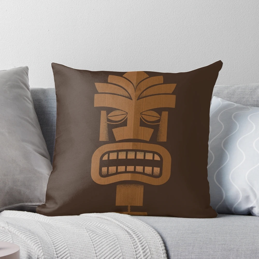A vibrant Tiki-inspired pillow with a tropical pattern, perfect for adding a touch of Hawaii-inspired style to your coastal home.