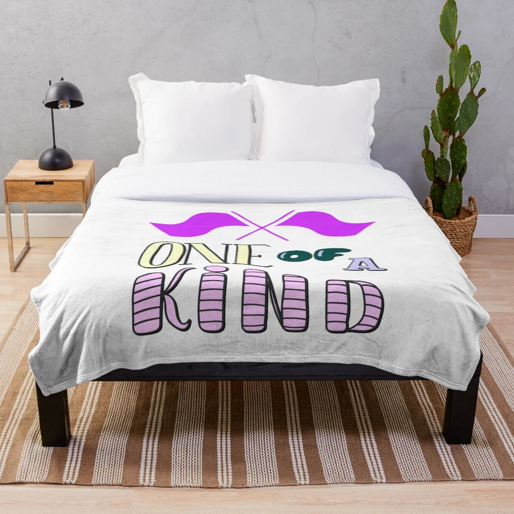 Colorful plush blanket featuring a color guard flag design for marching band enthusiasts
