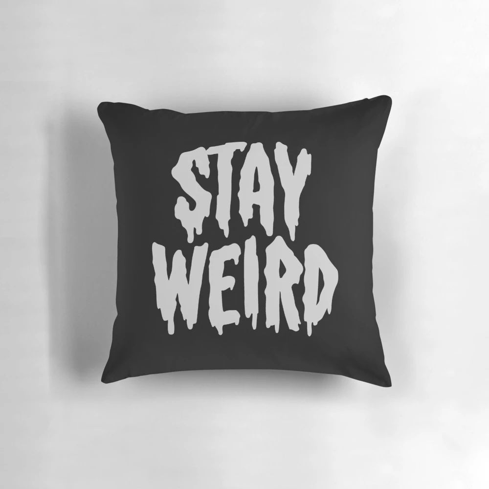Cozy "Stay Weird" typography throw pillow for unique home decor