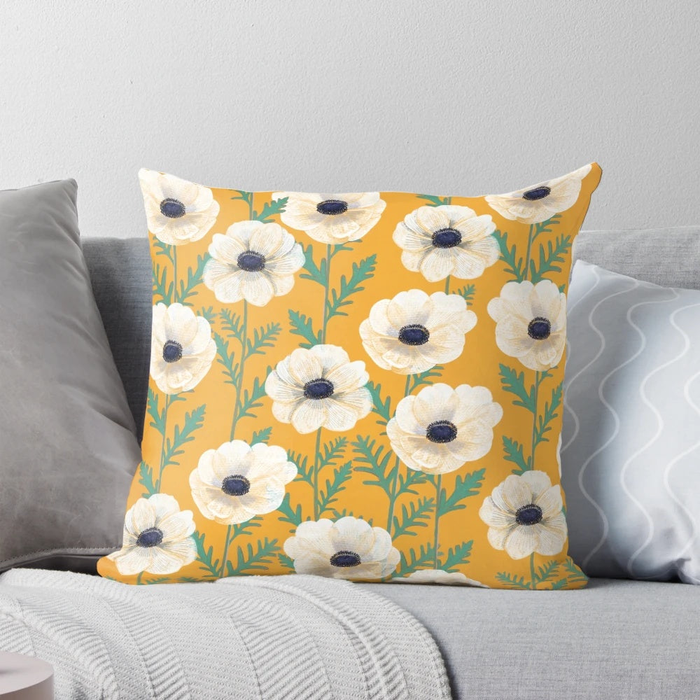 Colorful anemone flowers in a bold mango floral pattern on a decorative throw pillow