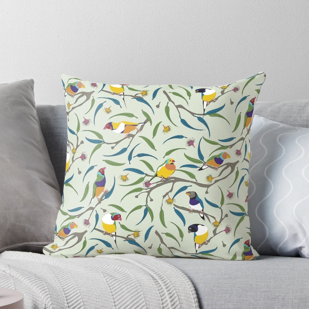 Colorful throw pillow featuring a vibrant Australian Gouldian finch, also known as the Rainbow finch.