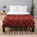 Vibrant bohemian-style plush blanket with intricate geometric patterns and oriental heritage influences