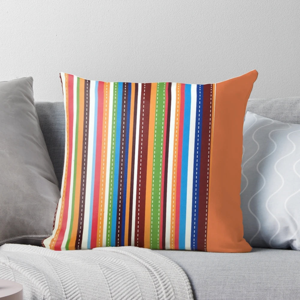 Brightly colored orange and white striped pillow with a fun stitched carrot design, perfect for adding a pop of preppy style to any room.