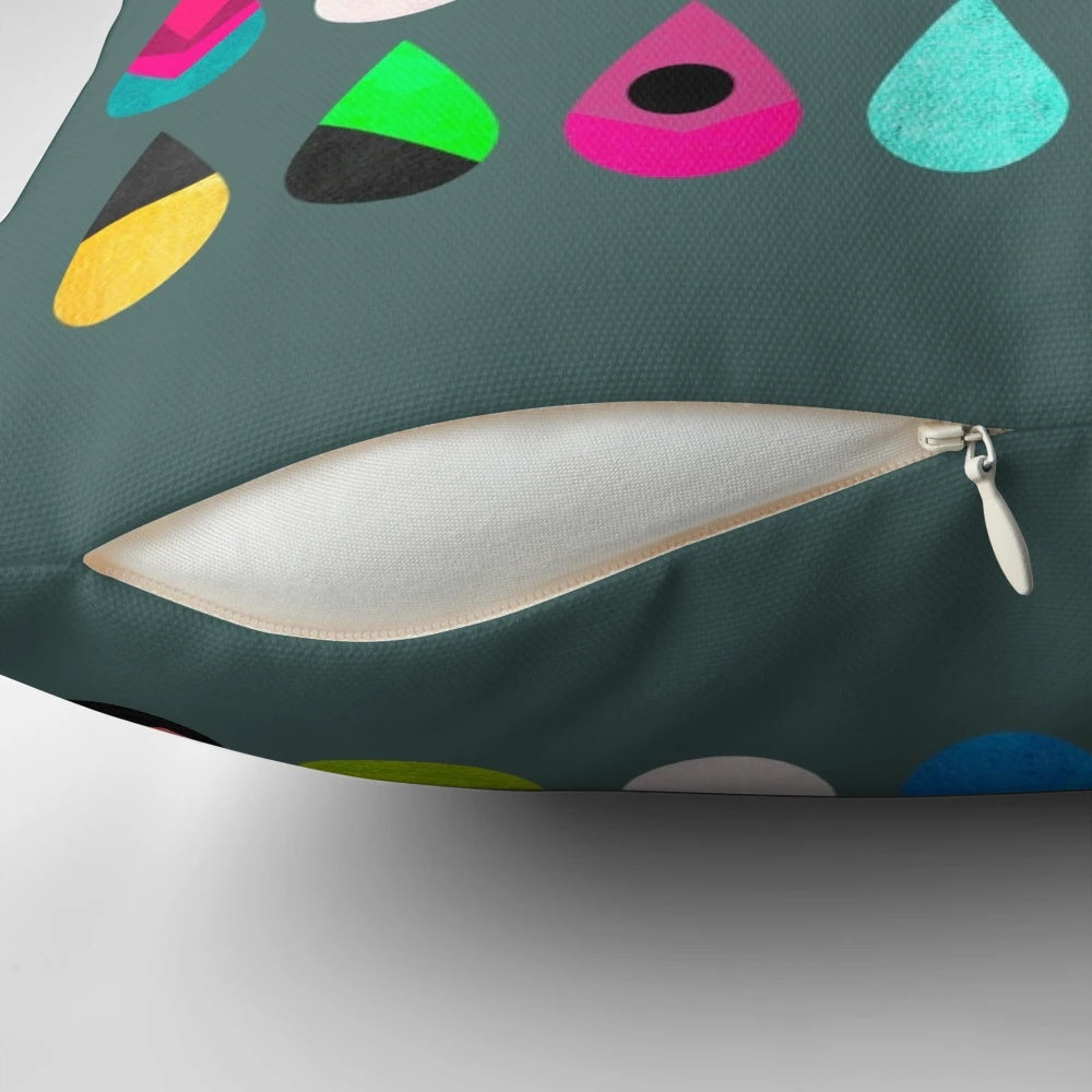 Colorful rain pillow with abstract graphic and multicolored droplet design