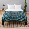 Gold and blue plush blanket with Egyptian scarab beetle design