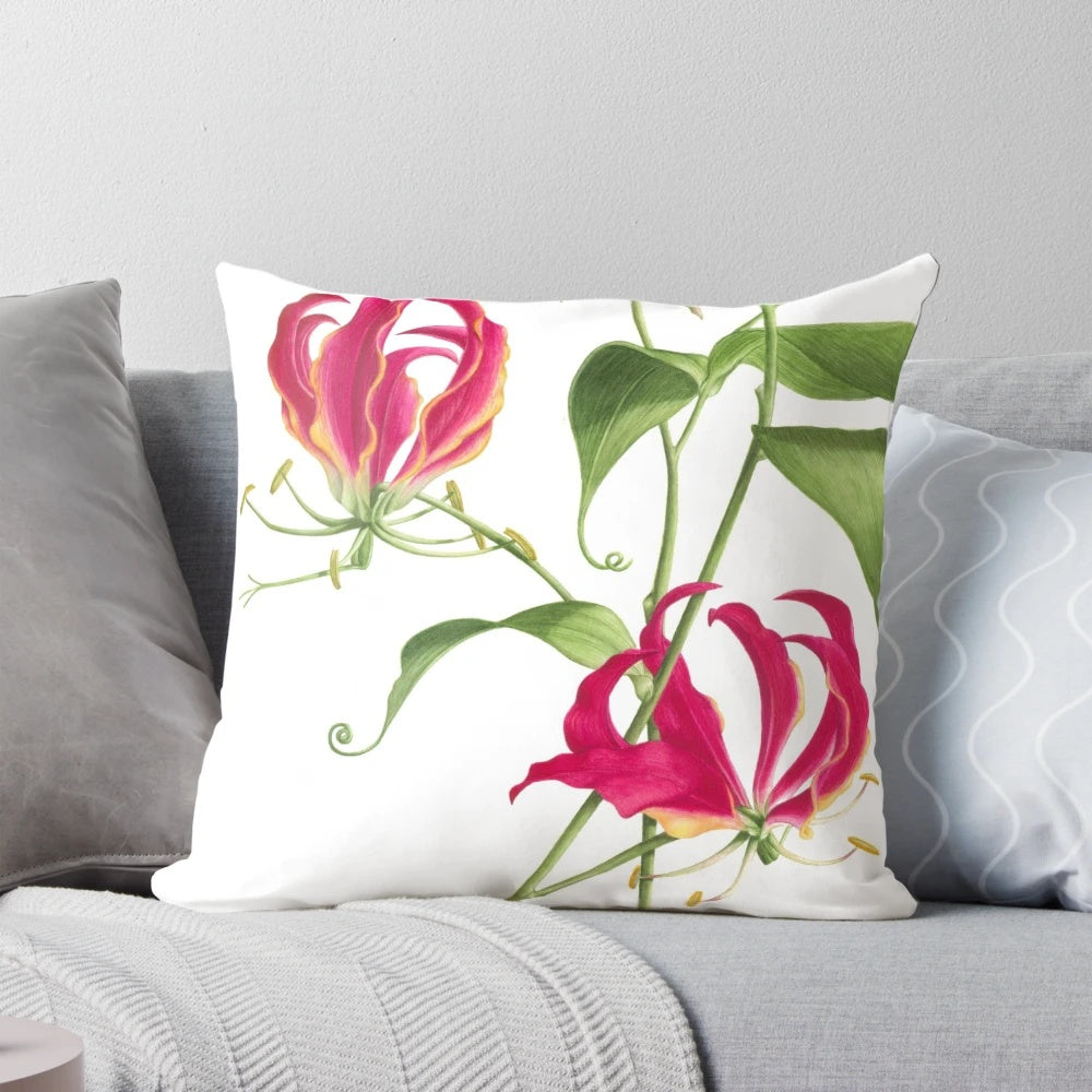 Vibrant watercolor painting of a flame lily flower on a decorative throw pillow