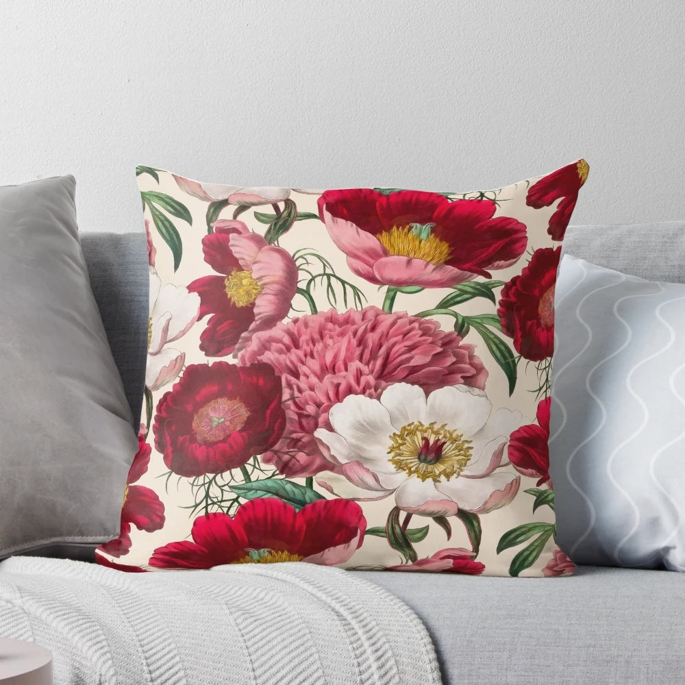 Colorful watercolor painting of a bouquet of pink, white, and red peonies and anemone flowers on a floral pillow.