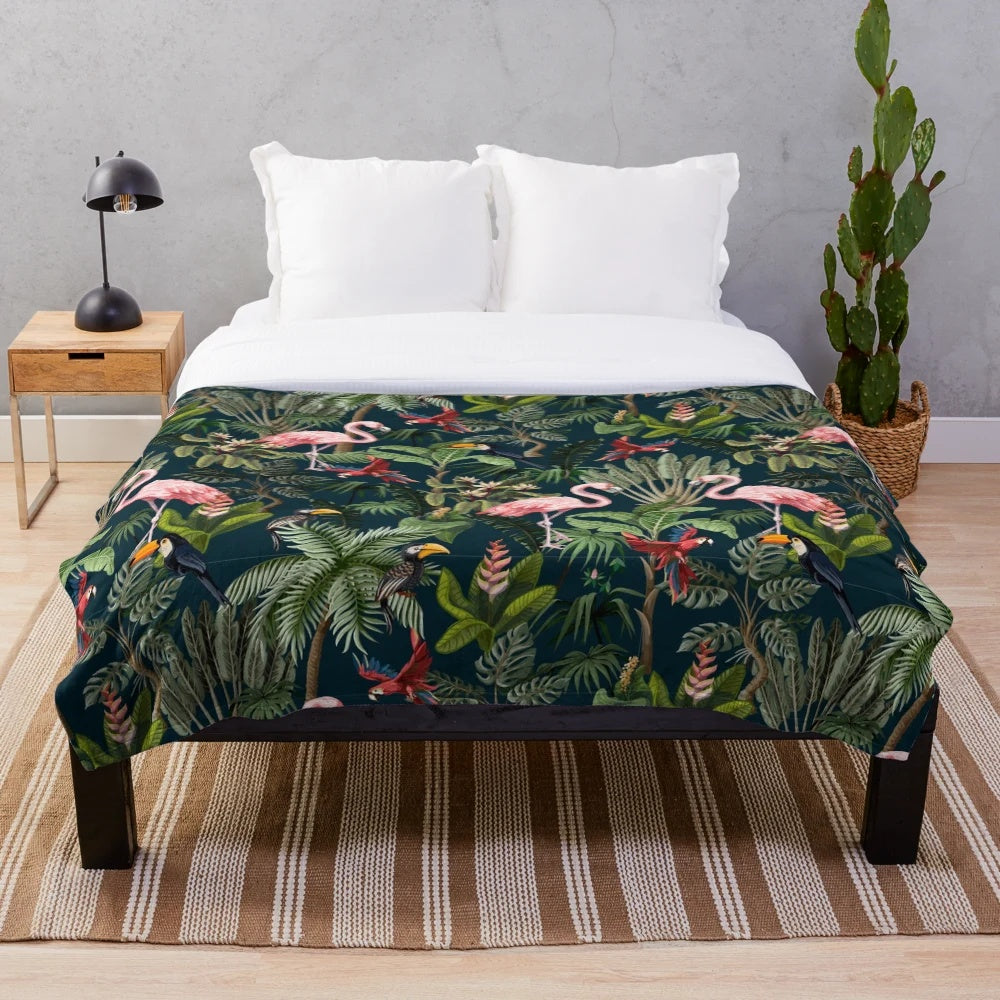 Colorful plush blanket featuring a jungle pattern with toucans, flamingos, and parrots