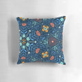 Colorful kaleidoscope pattern featuring cats and flowers on a soft, plush pillow