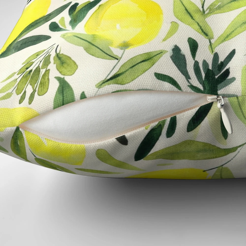 Lemons watercolor painting on a cream white pillow