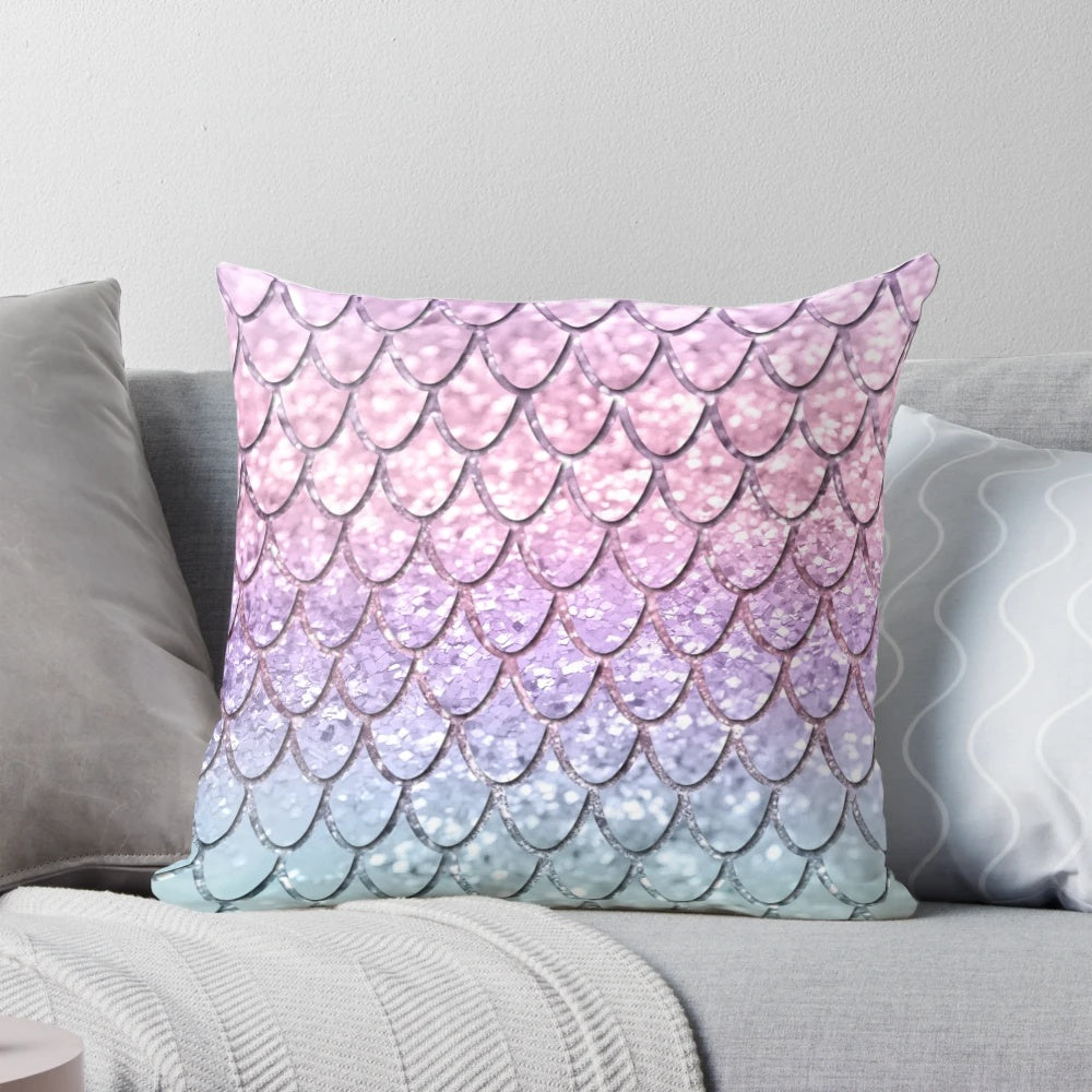 Colorful pillow with a digital collage design featuring mermaid scales and unicorn-inspired glitter patterns.
