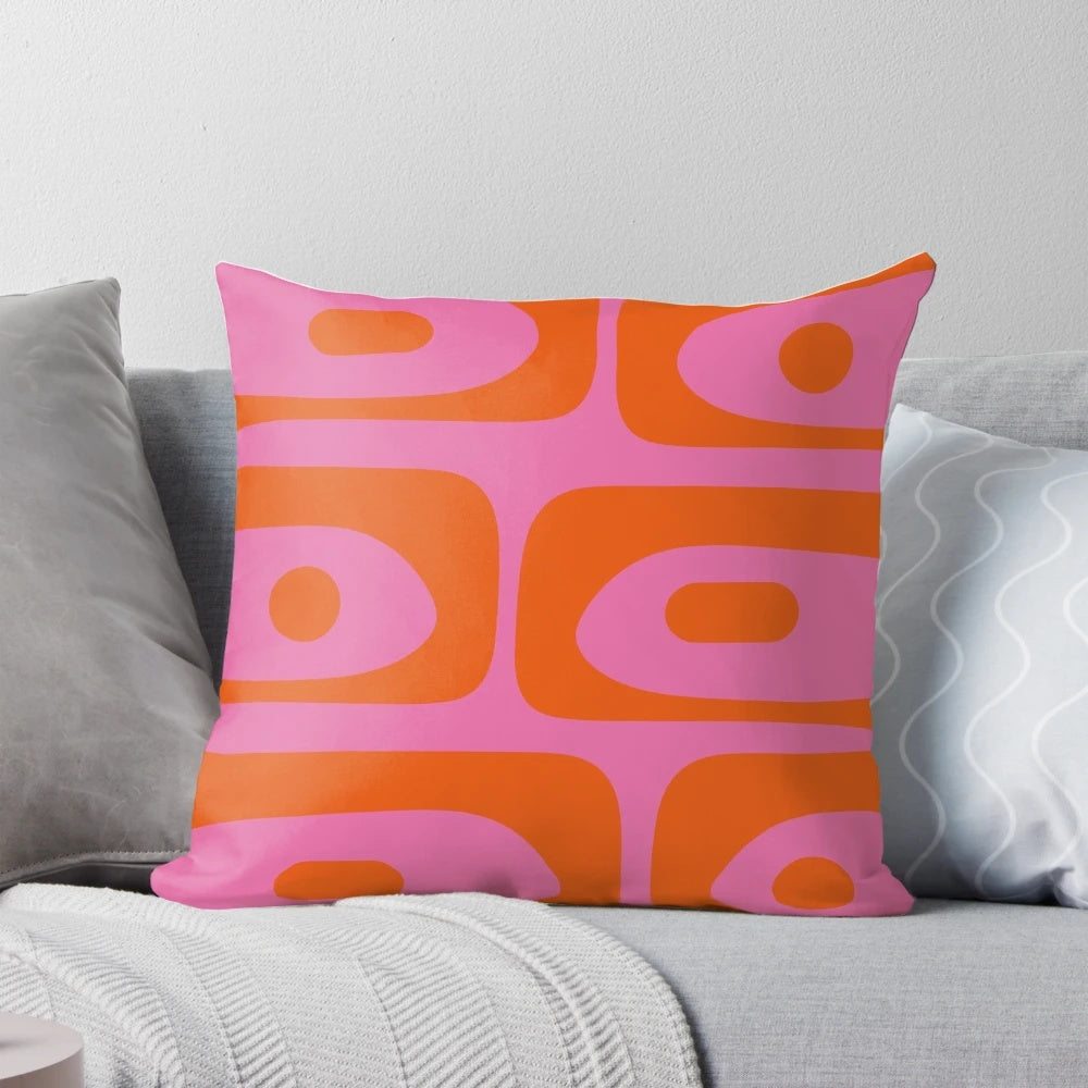 Colorful mid-century modern style abstract pattern throw pillow in pink and orange hues