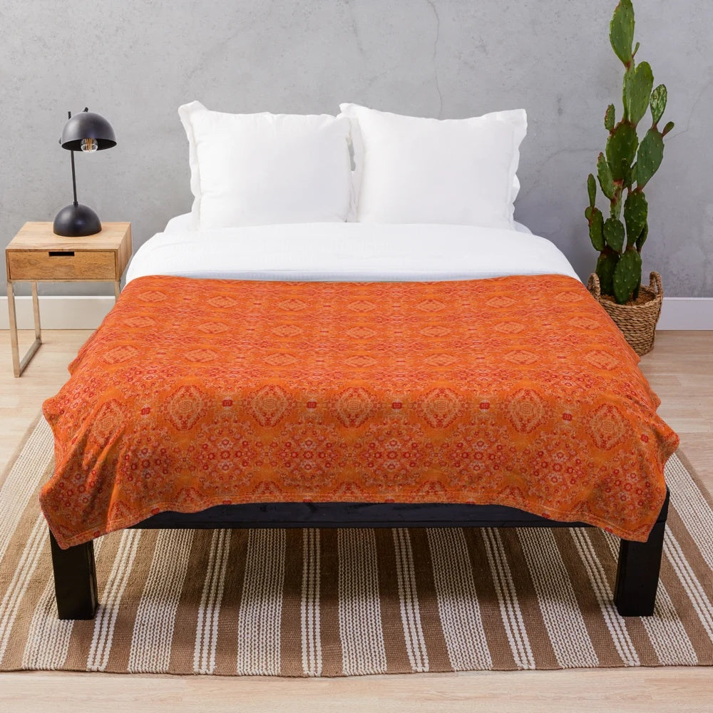 Cozy orange plush blanket with Moroccan-inspired design