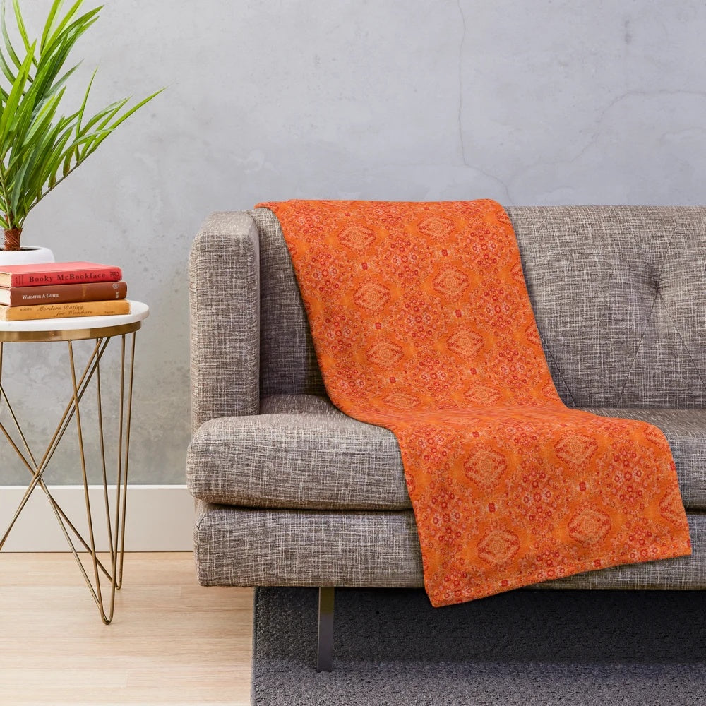 Cozy orange plush blanket with Moroccan-inspired design