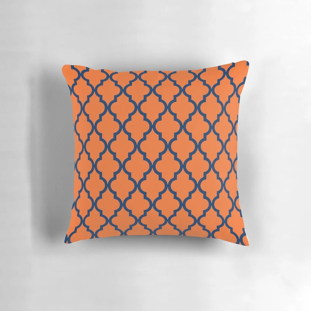 Moroccan-inspired orange and navy blue patterned pillow