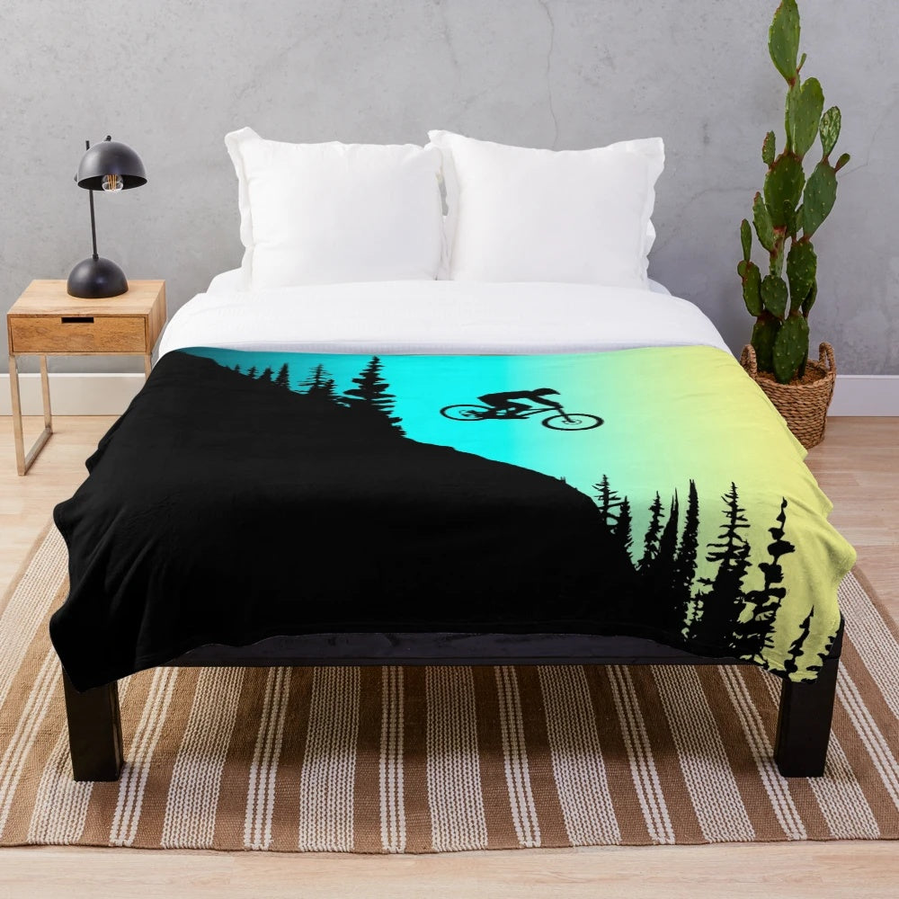 Colorful plush blanket featuring mountain bike design
