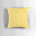 Mustard yellow and white pillow with abstract geometric lines and mosaic pattern design
