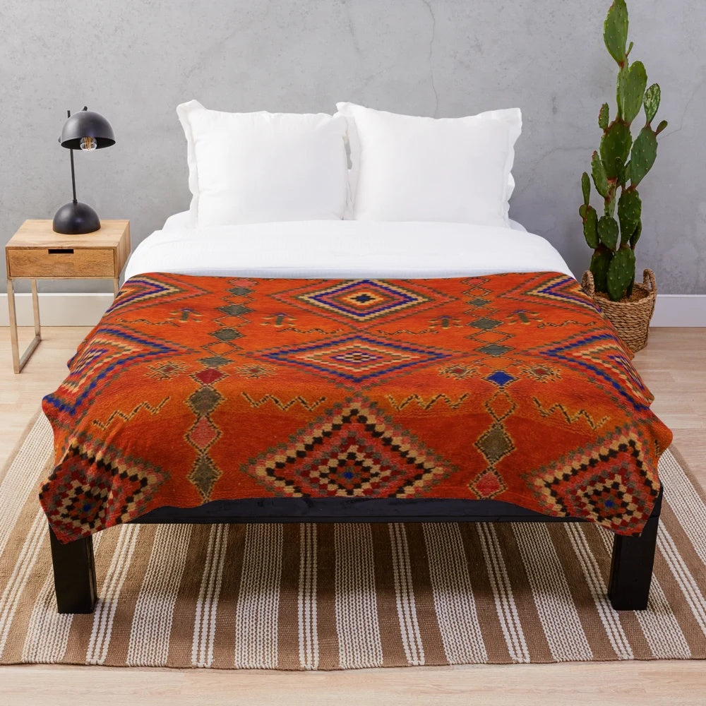 Orange Moroccan rug inspired plush blanket with abstract pattern