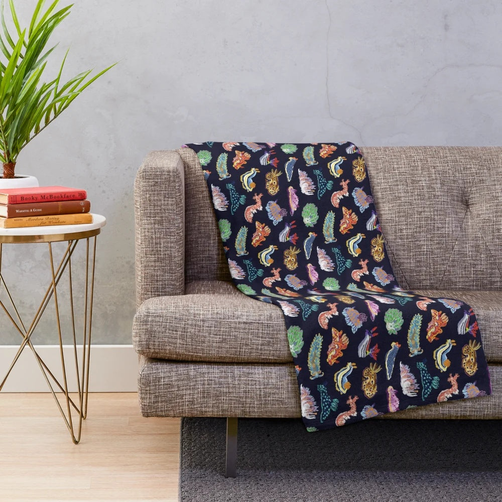 Colorful plush blanket with detailed sea slug/nudibranch design