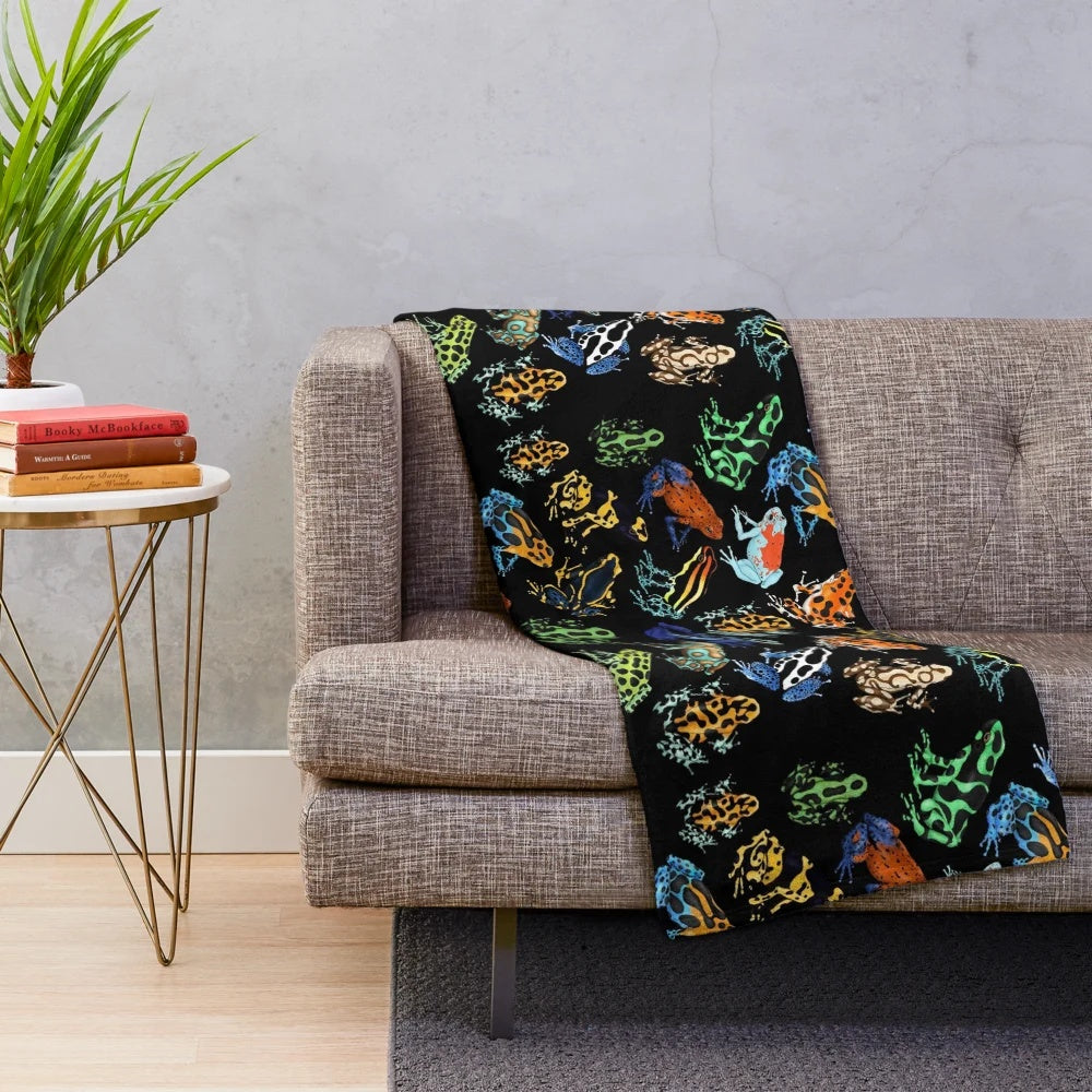 Soft, plush blanket featuring colorful poison dart frog design