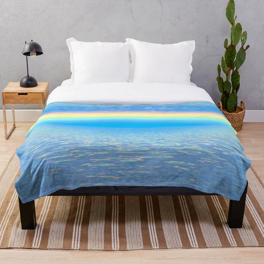 Colorful rainbow plush blanket with abstract patterns