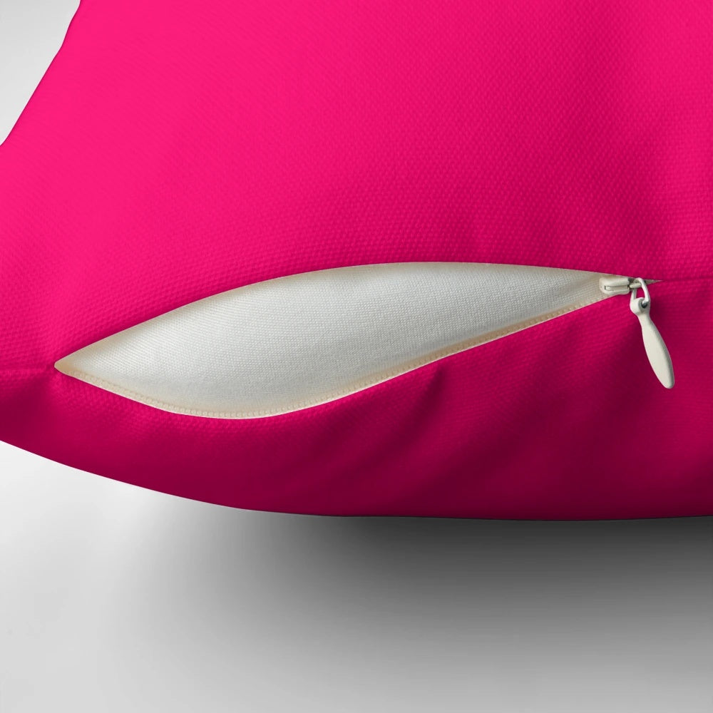 Vivid raspberry-colored pillow with a bright, neon pink hue