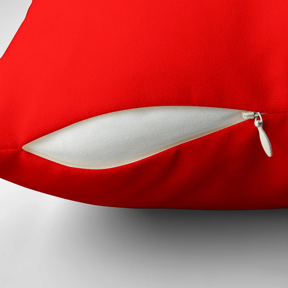 A fire engine red decorative throw pillow with a solid color design, perfect for adding a pop of color to your home.