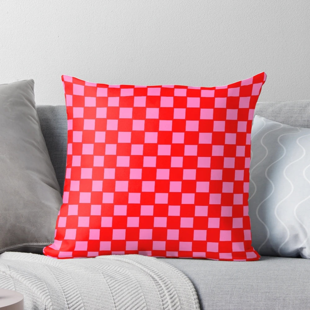 Colorful checkered pattern pillow in red and pink shades for bedroom, living room or kitchen