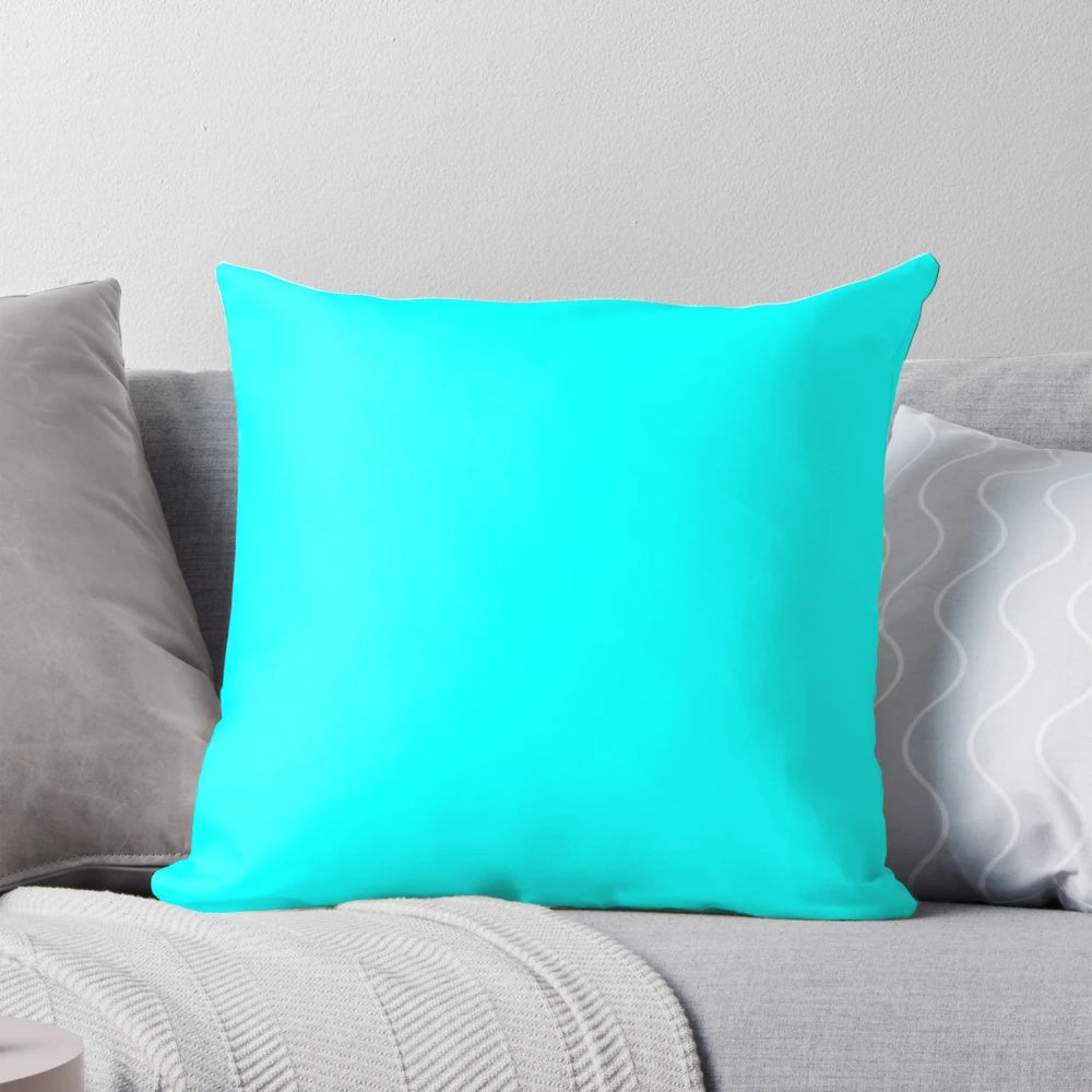 Solid cyan decorative pillow with turquoise and aqua accents, offering a modern and vibrant design for home decor.