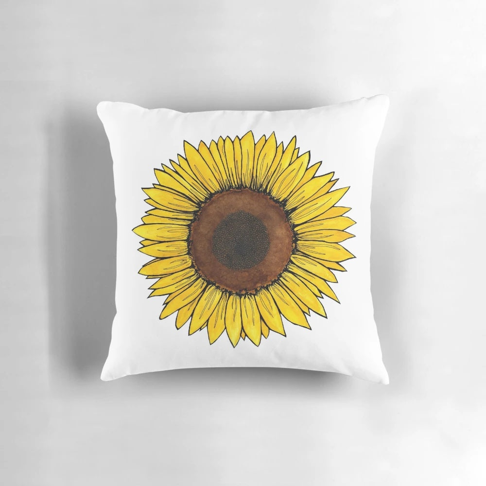 Colorful watercolor illustration of a sunflower on a soft, cozy throw pillow
