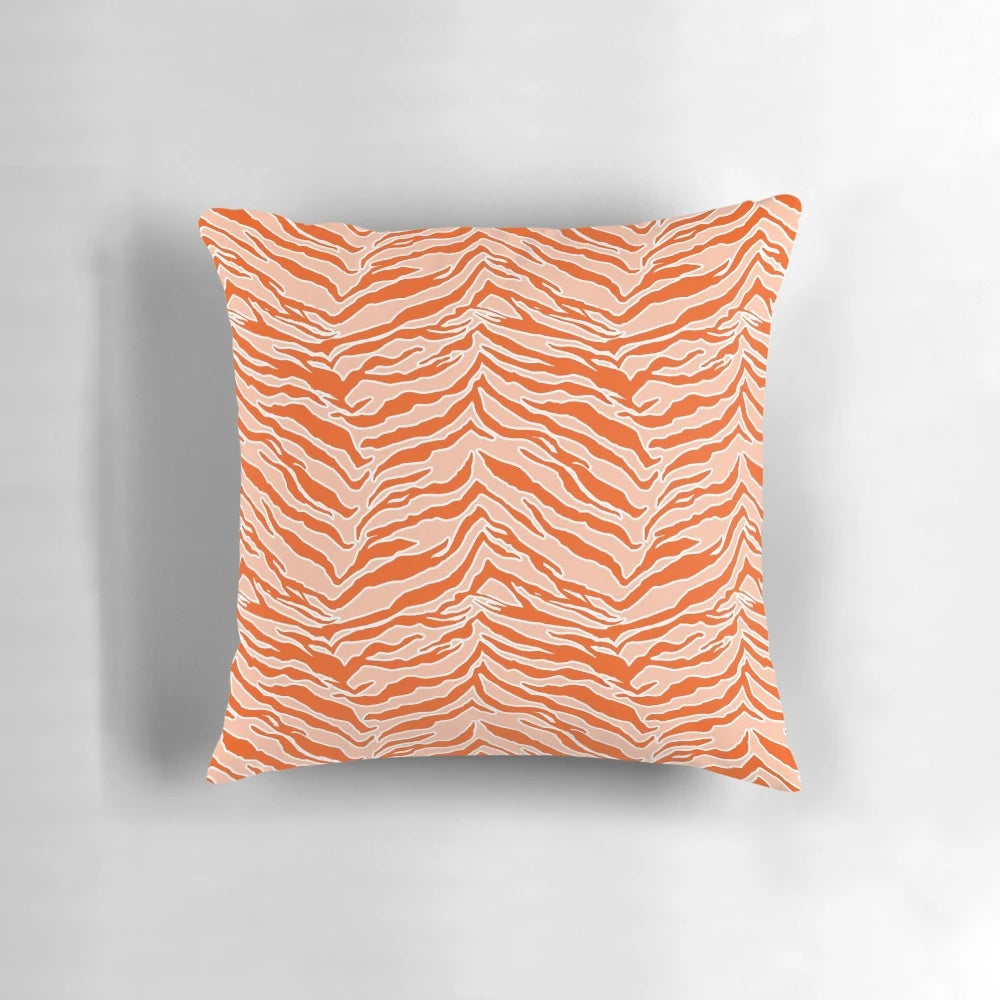 Closeup of an orange and black tiger print pillow