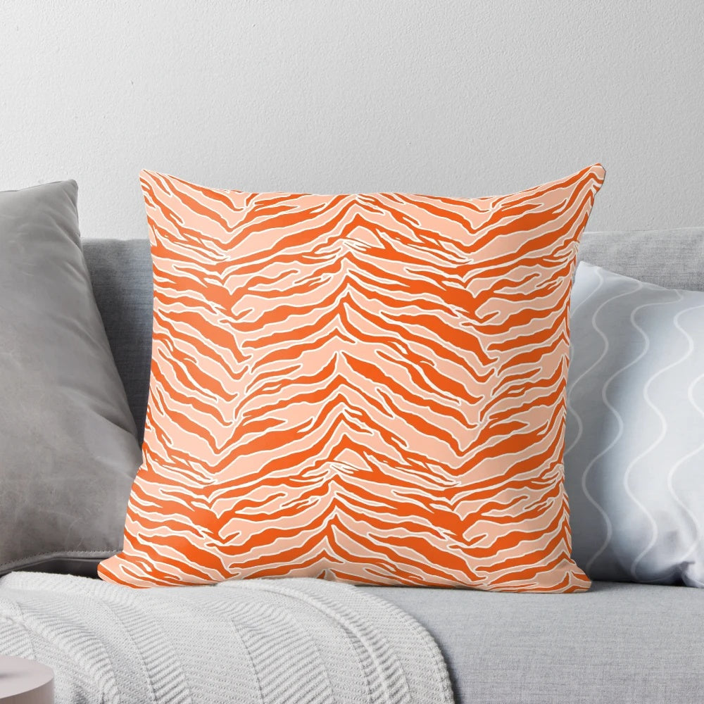 Closeup of an orange and black tiger print pillow