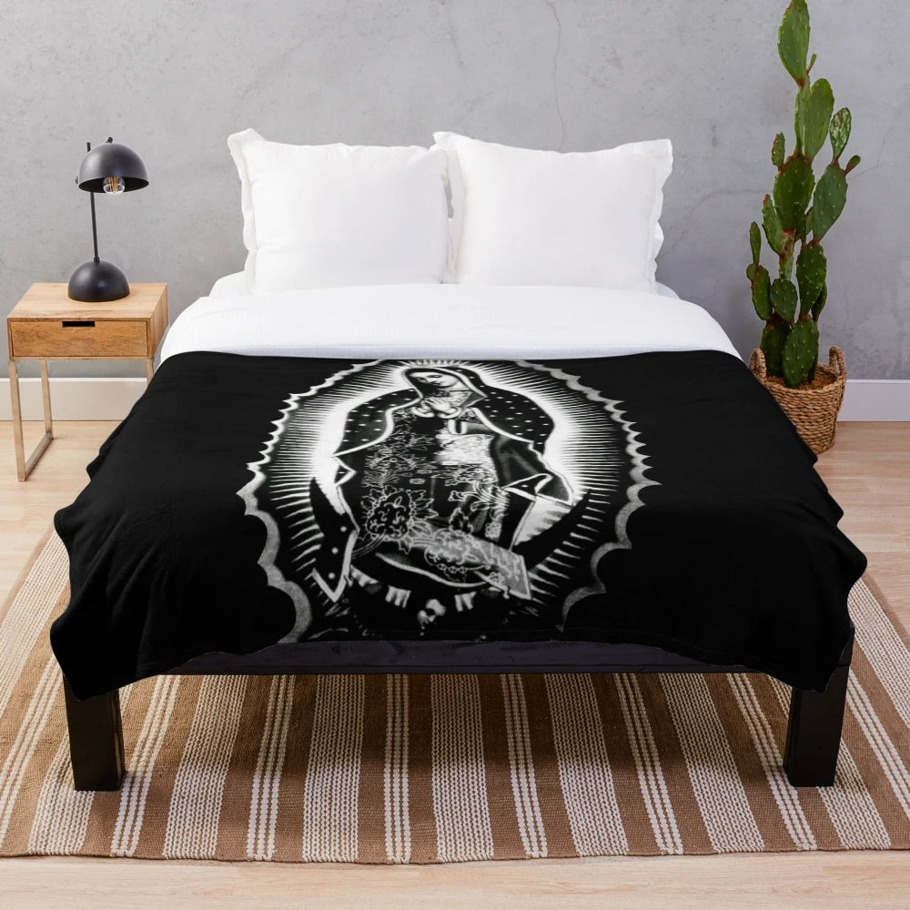 Soft and cozy plush blanket featuring the iconic image of the Virgin de Guadalupe