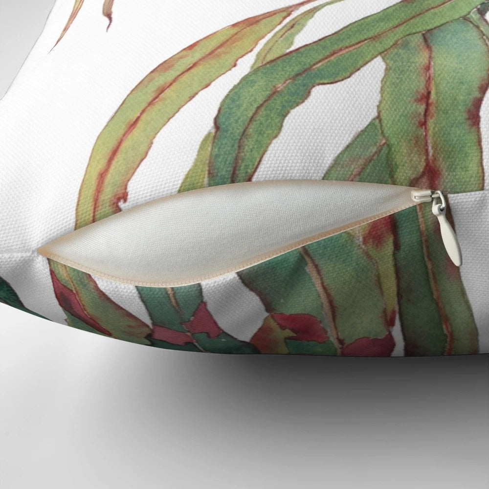 Watercolor painting of a eucalyptus branch with green and red leaves against a white background.