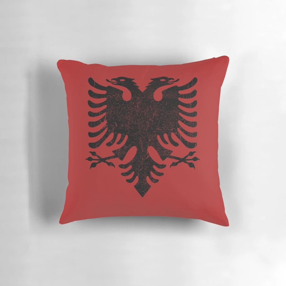 Vintage Albanian flag-shaped pillow with heart design, showcasing Albanian pride and patriotism.