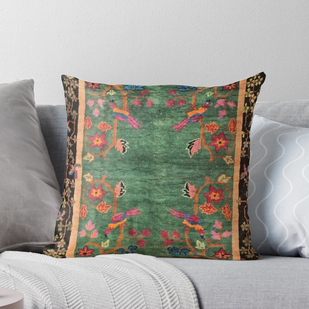 Vintage Art Deco Rug Print Pillow featuring a floral and bird design in emerald green and nature-inspired colors.
