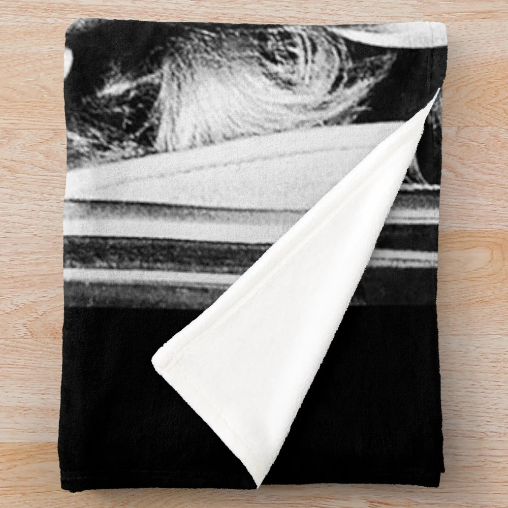 Vintage black and white portrait of Marilyn Monroe on a plush blanket