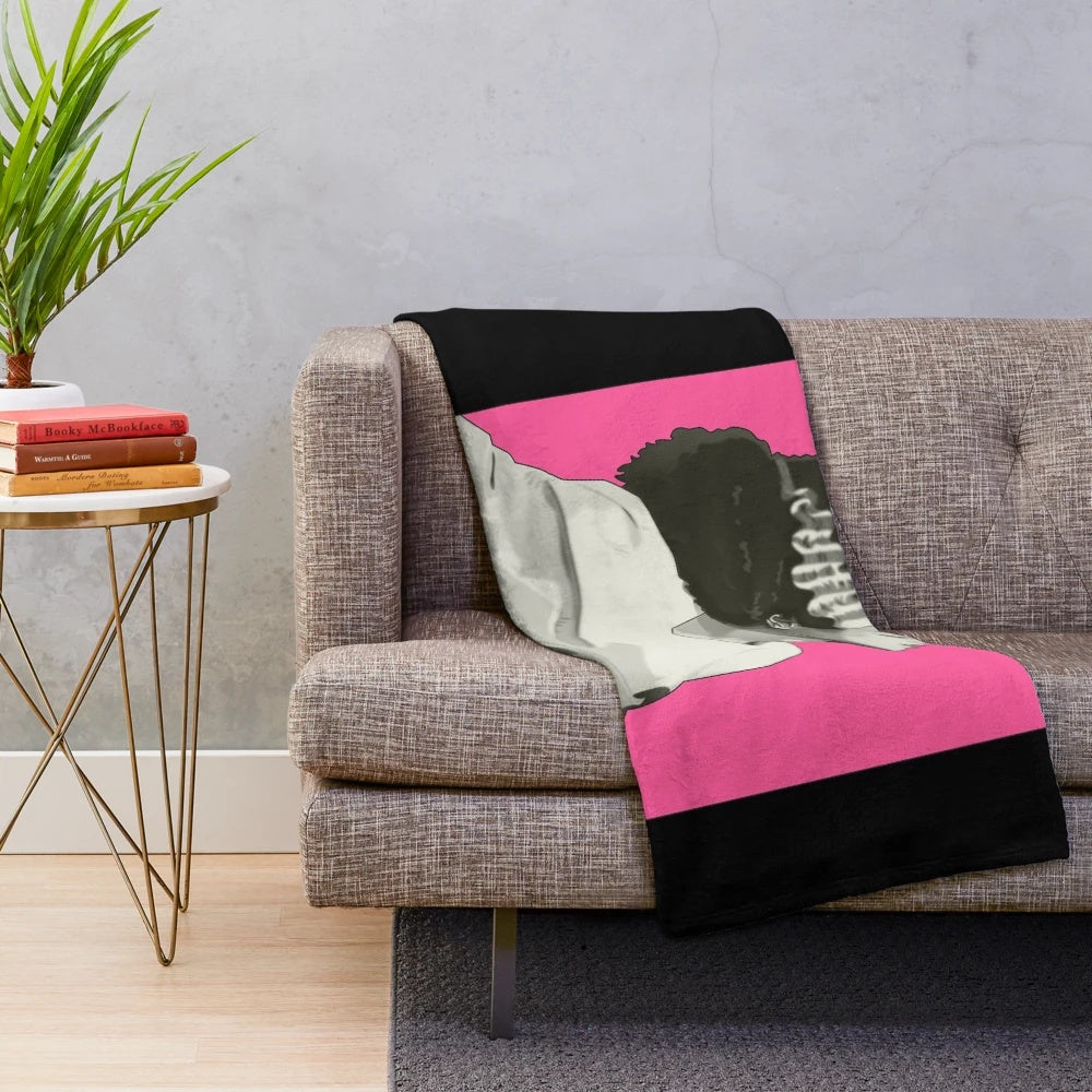 Vintage-style Bride of Frankenstein plush blanket with black and white horror movie graphics