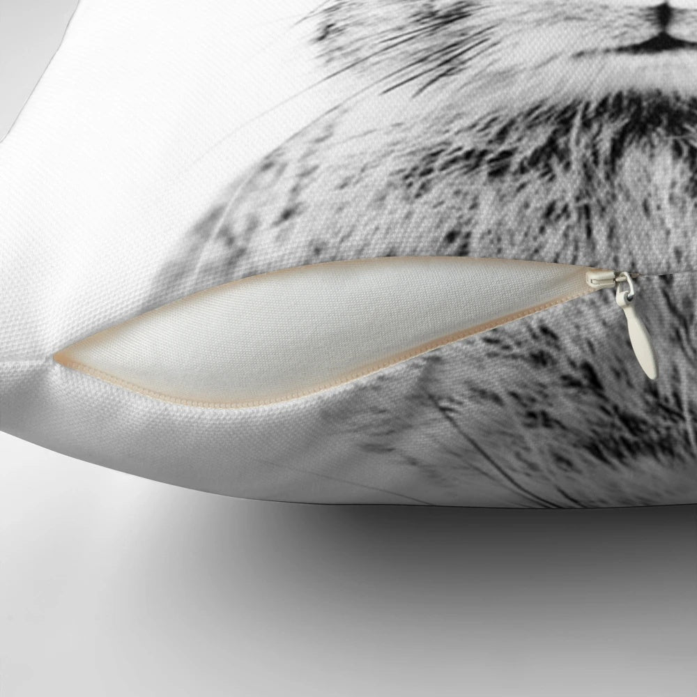Vintage-style minimalist line drawing of a bunny on a white background, printed on a decorative pillow.
