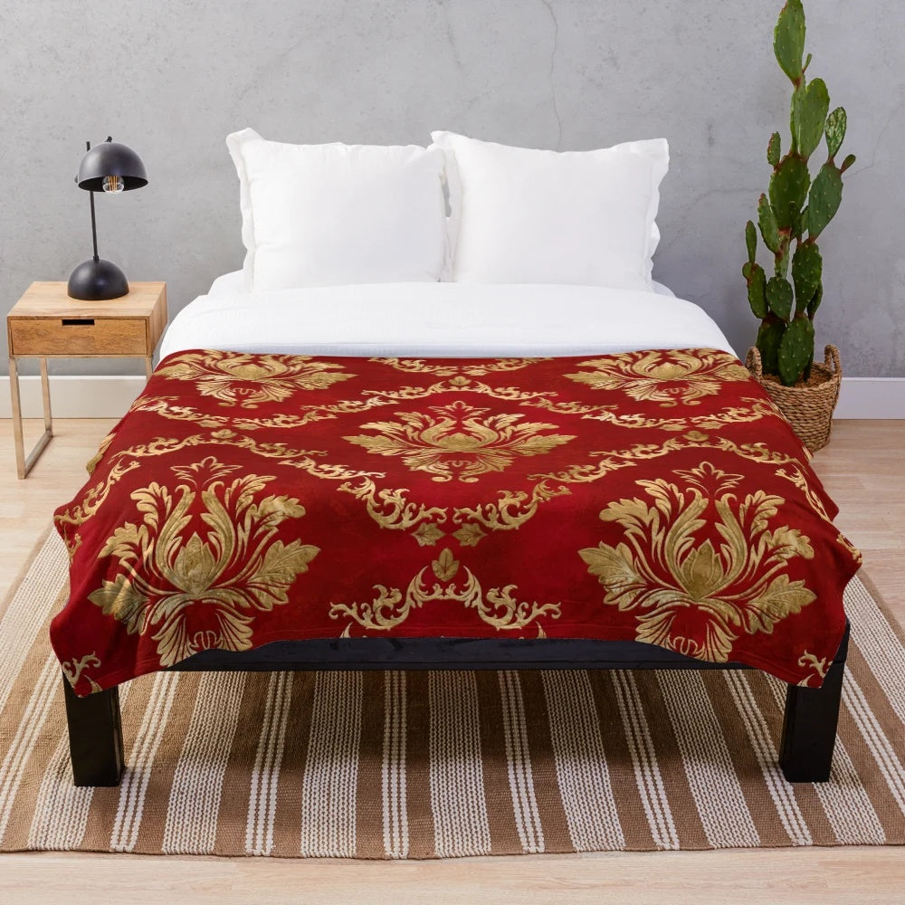 Vintage damask patterned plush blanket in red and gold colors