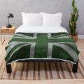 Distressed Union Jack flag pattern on a green plush blanket
