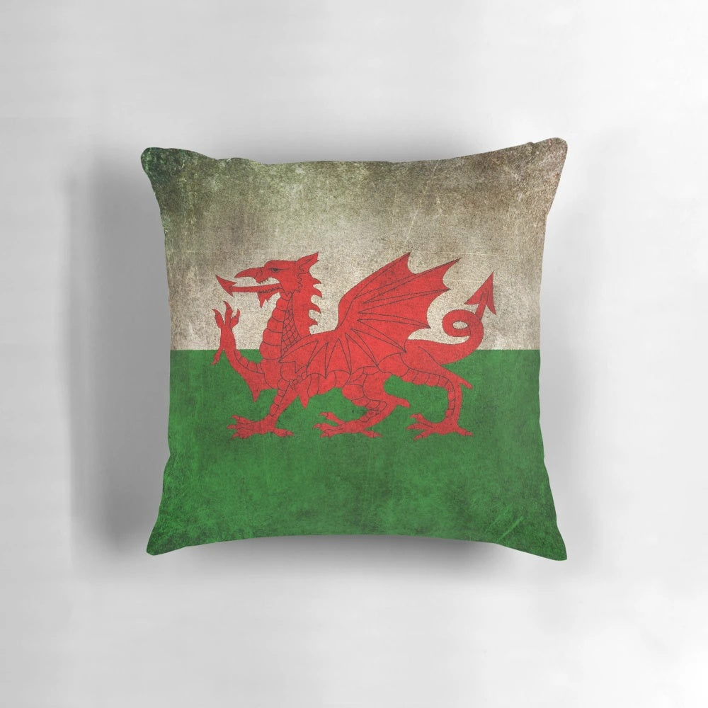 Old and worn vintage flag of Wales printed on a decorative pillow