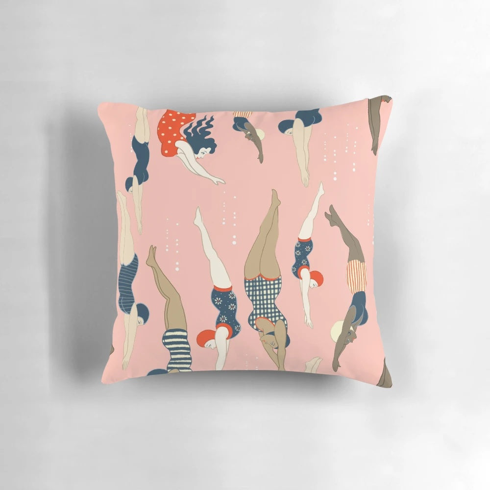 Vintage-inspired pattern of diving ladies in retro swimwear on a pastel floral pillow