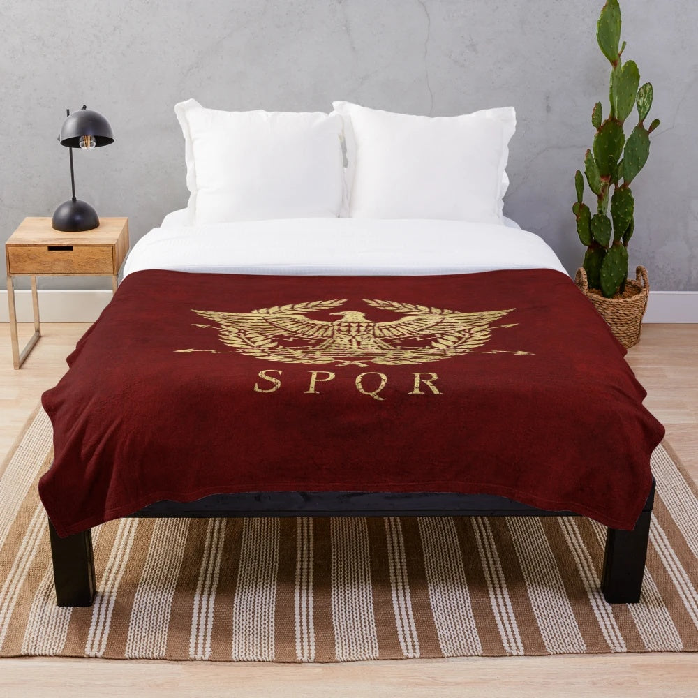 Vintage gold plush blanket featuring the iconic Roman Empire emblem